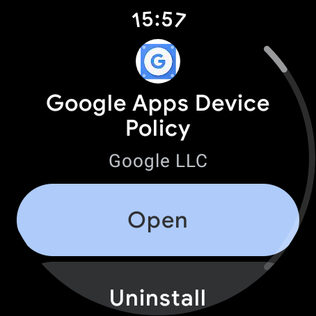Google Apps Device Policy showing in the Google Play store on WearOS. The image is circular, reflecting the watch’s circular screen. The app is installed so there’s a big “Open” button and an “Uninstall” just visible underneath.