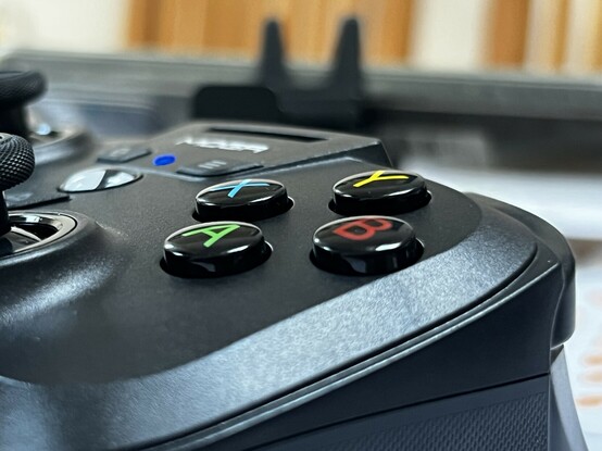 A low angle photo of the main face buttons: ABXY.  They have a good definite click and about 1.5mm of travel.
