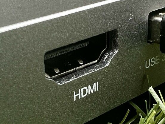 A close up of the HDMI port. It’s surrounded by the aluminium enclosure and the hole for the port- when looked at closely- resembles a very regular cave or the work of some stubborn cybernetic rats.