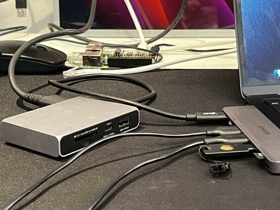 A picture of another dock plugged into the pass-through port and - just in the top edge of the picture if you recognise Apple wallpaper - showing a picture over HDMI.