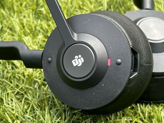 Close up of the Engage 55s ear cup showing the large volume dimples at the top and bottom and the dedicated “Teams” button for calls in the middle.