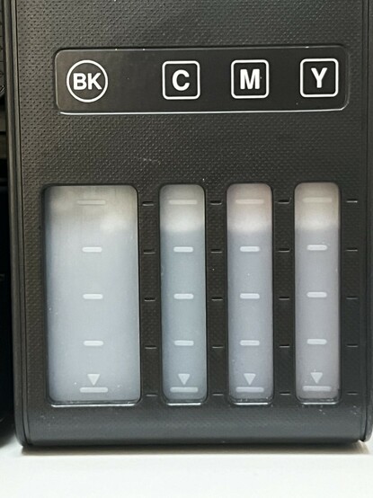 A photo of the actual printer showing the ink tank levels. The ink colour is basically not discernible at all.