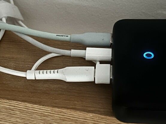 The JSAUX Apple Watch charger plugged into a desktop Anker power supply. The tether on the USB C adapter sticks awkwardly under the adjacent USB C plug. It wouldn’t fit well next to a USB A plug.