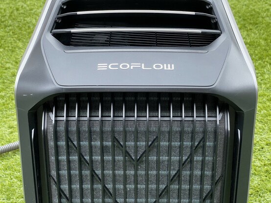A front view of the EcoFlow WAVE 2. The front grille is an inlet and is rather dusty. The EcoFlow Logo is emblazoned across the top.