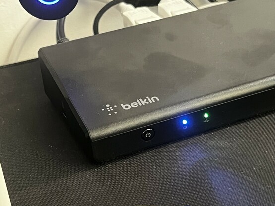 The left-hand edge of Belkin’s Triple Displah dock. There’s a power button, a blue power LED and a data LED.