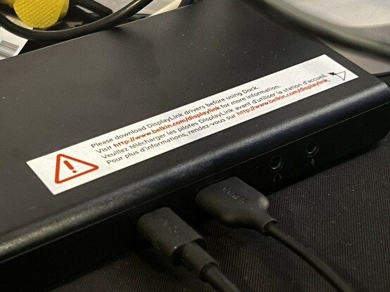 The warning label on top of the dock. It asks you to please download the DisplayLink drivers before using. It feels like this label might be the result of several confused customers not quite understanding that specific drivers are required to make it work properly.
