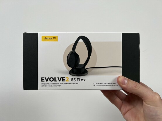 A shot of the outside of the box. It’s compact and plain with a white branded sleeve on the outside showing the Jabra branding. A picture of the headphones. And the name.
