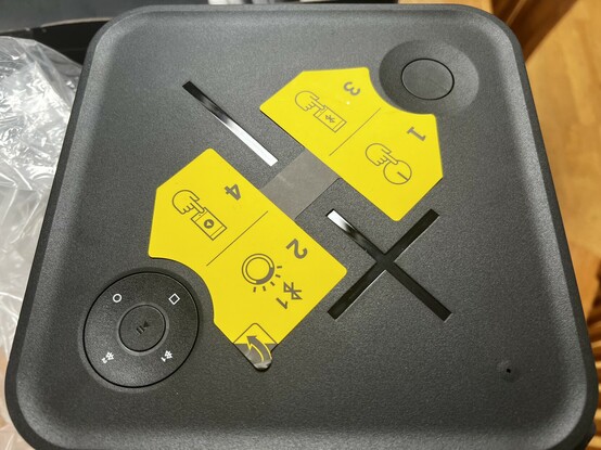 The top of the HYPERBOOM showing two bright yellow stickers giving vague but useful Bluetooth pairing instructions.