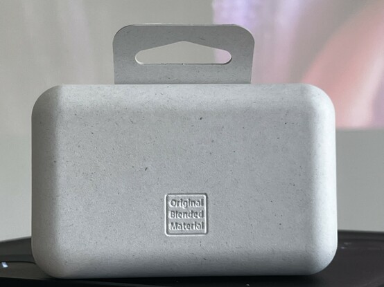 The back of the packaging with the white outer branding sleeve removed. It has “Original Blended Material” embossed towards the bottom.