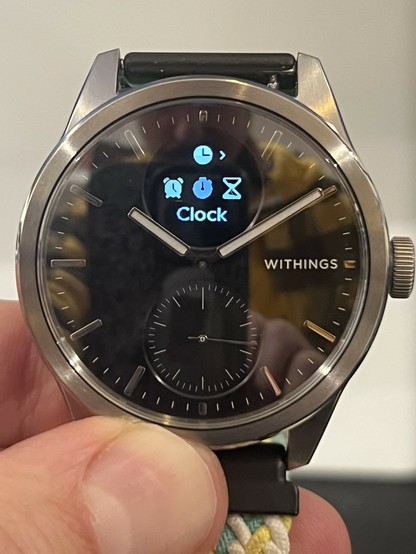 The ScanWatch 2 showing the clock settings page. It uses the greyscale levels to highlight options which are currently enabled.