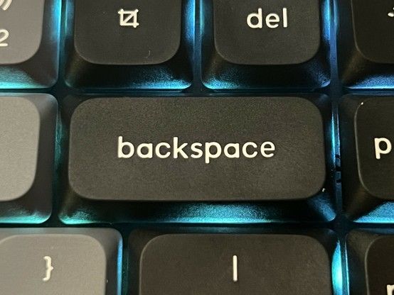 Close-up of a black computer keyboard, focusing on the 