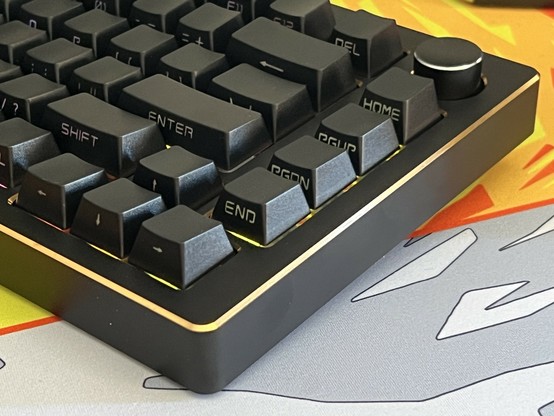 A close-up of a mechanical keyboard with black keycaps, featuring keys labeled 