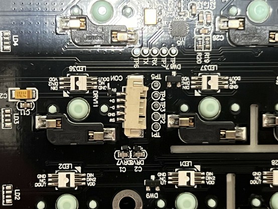 A close up of a PCB showing a 5 pin JST socket mounted at a slightly jaunty, almost disconnected angle.