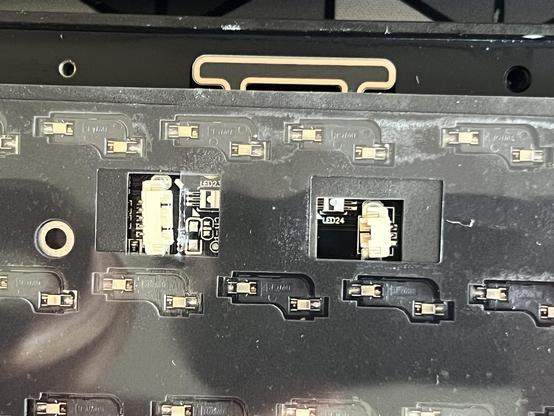 A top down photo of a keyboard PCB showing two JST connectors misaligned (twisted) by a few degrees.