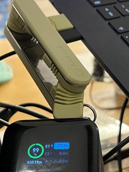 A pen knife like folding USB-C cable awkwardly contorted to connect a battery to a laptop. The battery shows the laptop is currently pulling 27.2W.