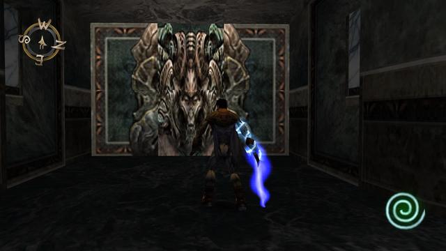 Screenshot from a PlayStation game showing Razael - an ethereal sword wielding undead soul eater - stood in front of an intricate door with a monstrous face picked out in rustic green and copper. It’s clearly split into six sections with textures not quite lining up 