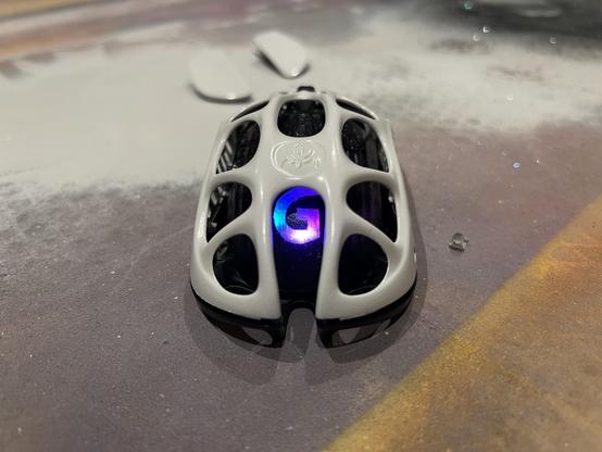 The back of the mouse. Light shines through a horribly hand cut G logo stencilled into the paintwork.