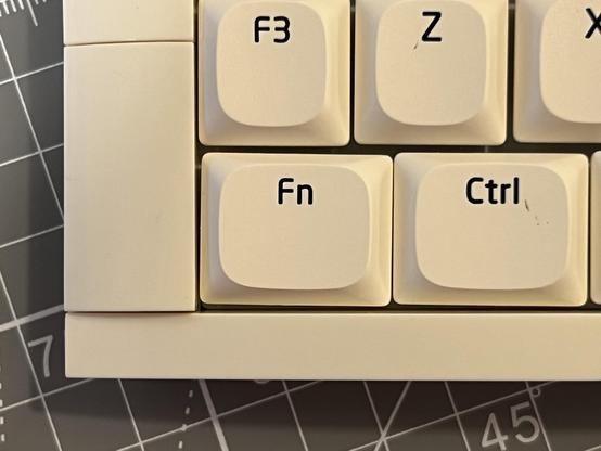 It could be PEBKAC error or it could be design flaw but the edge of the Fn key is almost touching Ctrl. Other keys are also not exactly uniformly spaced suggesting either a tolerance issue with the caps or with the PCB.