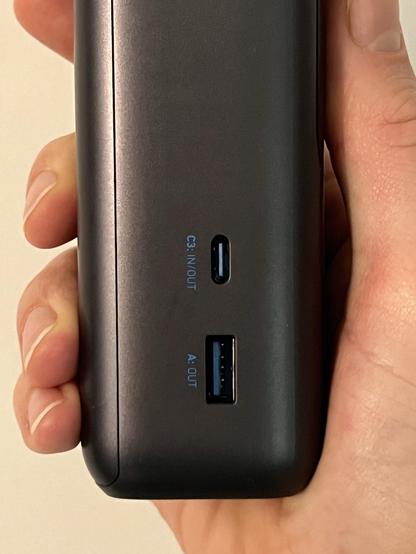 The side of a portable battery showing a USB Type C port labelled “C3: In/Out” and a Type A port labeled “A: Out.”