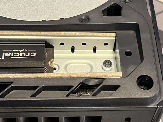 A closeup of the Crucial T500 SSD inserted into the SSD slot. It falls very far short of the 110mm screw, but then it is a 2280 (80mm) SSD.