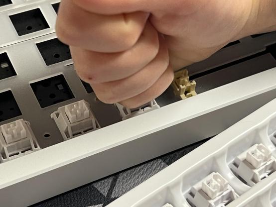 A tiny fist unceremoniously hammering the switch home. 