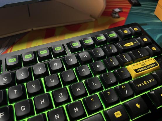 A fully populated keyboard with mostly convex keys. The zero key in the number row is the odd one out.