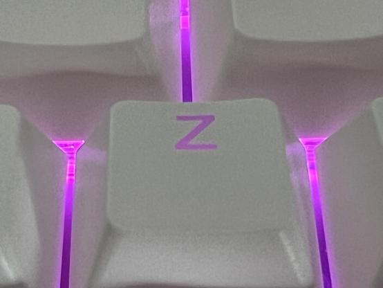 Extreme closeup of a Z key backlit with pink light