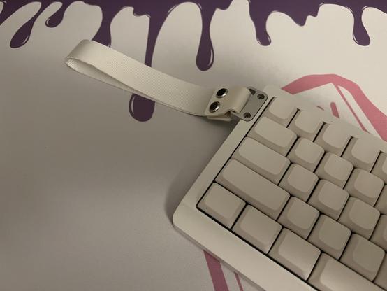 A wide show of the keyboard and strap. It’s completely silly and superfluous but looks kinda nice.