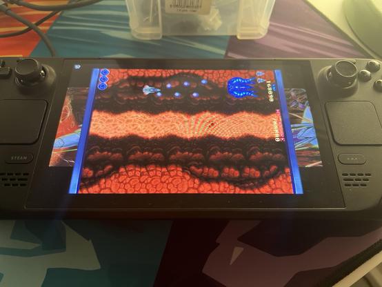 A vertical scrolling shooter displaying on the Steam Deck, rotated to be left to right side scrolling and fill the screen.