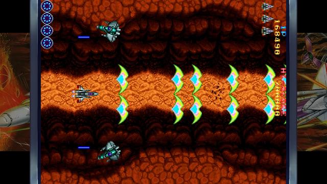 A retro arcade vertical shooter with a ship flying over a canyon backdrop and spamming the screen with great green bat-wing shaped projectiles. It's turned 270 degrees (well actually 90 but apparently the authors don't do clockwise) so that it plays left to right rather than top to bottom.
