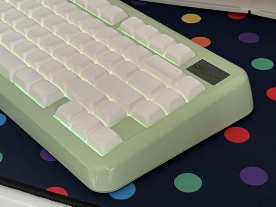 View of the right of the keyboard showing the arrow keys and a somewhat comically deeply scooped backspace.