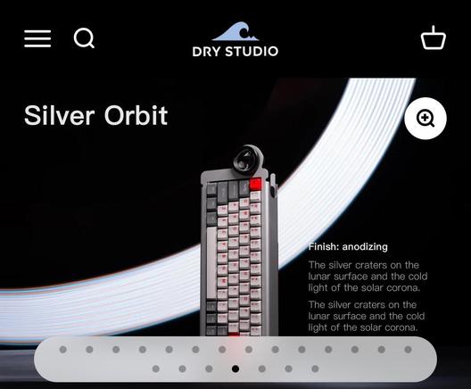 A sort of folded metal looking keyboard with a weird lens thing off at one end.