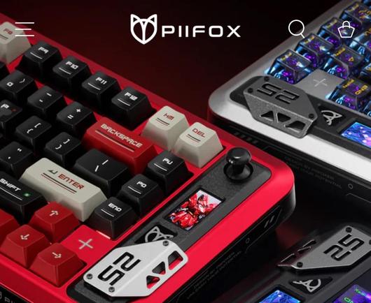 Closeup of red, black and silver keyboards with LCD displays, little joysticks and bolted on badge details.