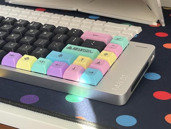 Colourful KAM Astha (mid profile, uniform) keycaps populating a Lofree Flow 2 - compact, aluminium, silver - keyboard.