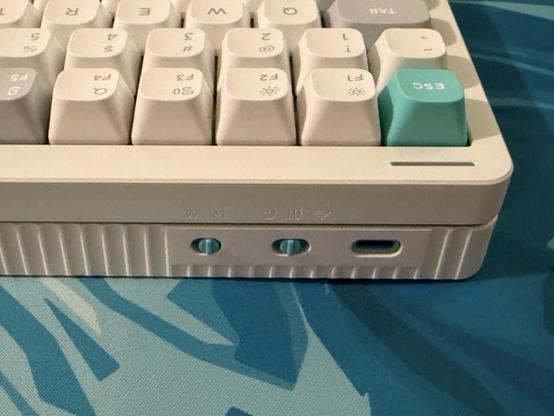 The back, left-hand edge of the keyboard showing teal accented mode and macOS/Win switches alongside a teal USB-C port and the teal Esc key. It’s so very satisfying.
