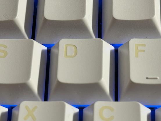 A D key showing the legend inset into the surface of the key.