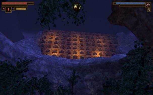 A low poly scene depicting a towering wall of prison cells lit with orange light and set amidst blue craggy rocks and green trees.