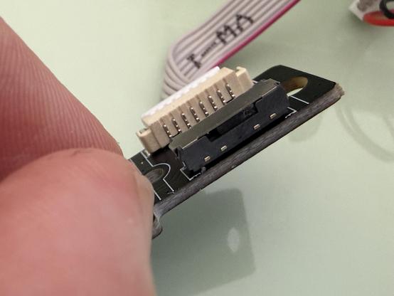A keyboard power/Mode switch daughter board. The little plastic switch has been broken off making it unusable. Oof.