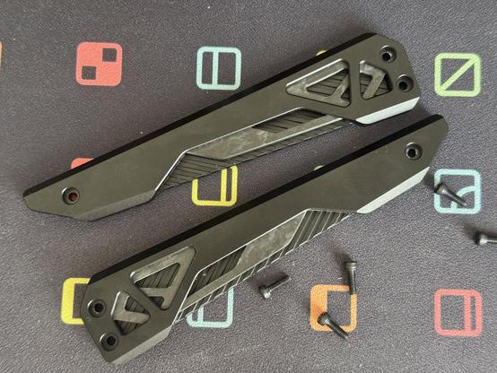 The left and right hand sides of the IQUNIX EV63 HE keyboard. They look like parts from a Gundam.