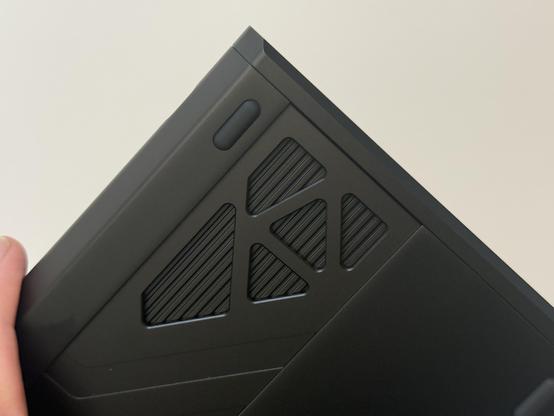 A series of polygonal cutouts in the bottom badge revealing a grooved inner detail.