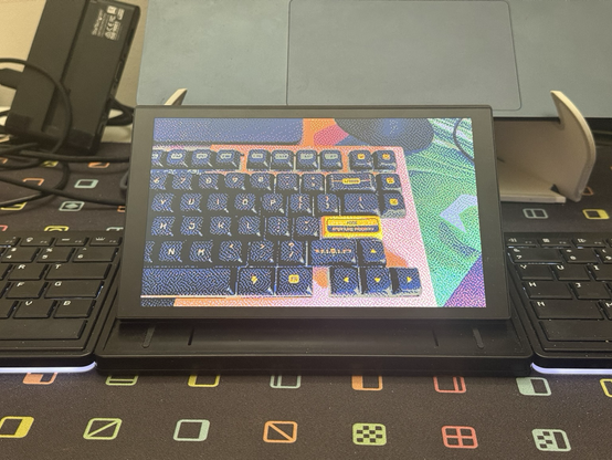 A heavily dithered and paletted picture of a keyboard showing on a keyboard. Or at least the Tetra keyboard’s very large touchscreen LCD.